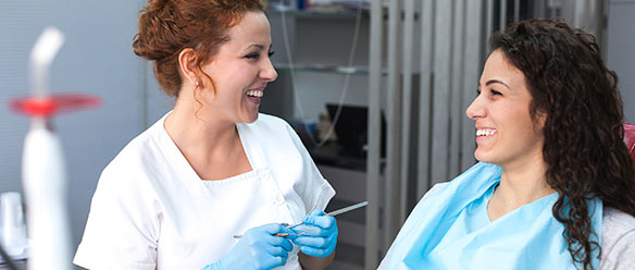 young woman patient and dentist