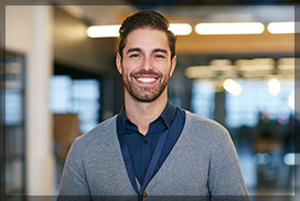 Young Male Smiling after Teeth Replacement