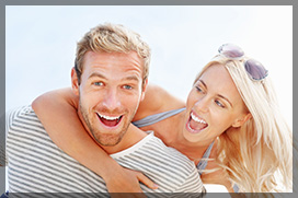 Cheerful Young Couple With Perfect White Teeth