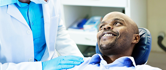 Dentist talking to patient