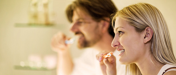 Couple Brushing Teeth