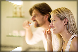 Couple Brushing Teeth