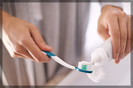 Forcing Toothpaste on a Toothbrush before cleaning his teeth